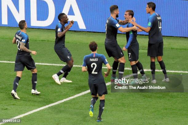 Antoine Griezmann of Croatia celebrates scoring his side's second goal with his team mates during the 2018 FIFA World Cup Final between France and...