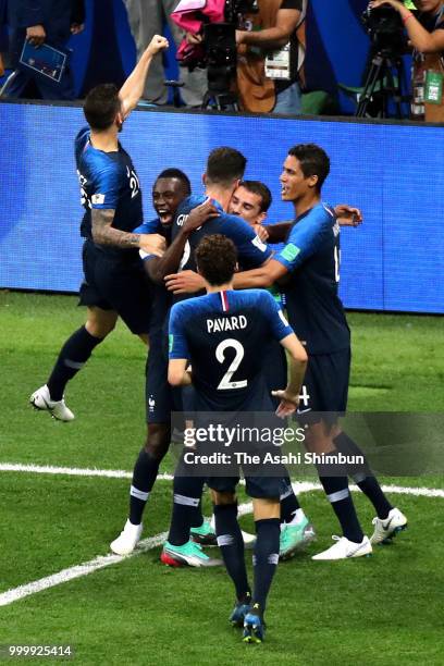 Antoine Griezmann of Croatia celebrates scoring his side's second goal with his team mates during the 2018 FIFA World Cup Final between France and...