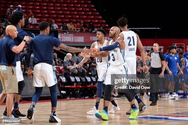 Jevon Carter of the Memphis Grizzlies high fives his teammates during the game against the Philadelphia 76ers during the 2018 Las Vegas Summer League...