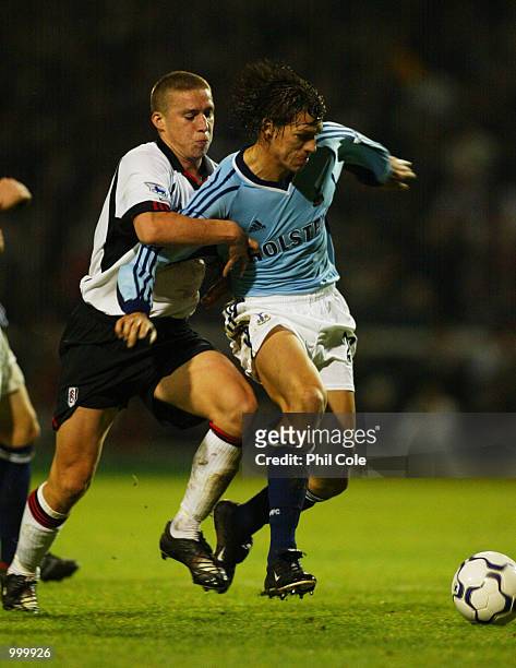 Sean Davis of Fulham tries to tackle Christian Ziege of Tottenham Hotspur during the Worthington Cup, 4th Round between Fulham and Tottenham Hotspur...