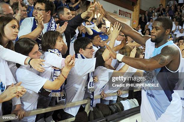 Roanne's US guard David Noel is congratulated by supporters at the end of the French ProA basketball play-off match Roanne versus Orleans on May 19,...
