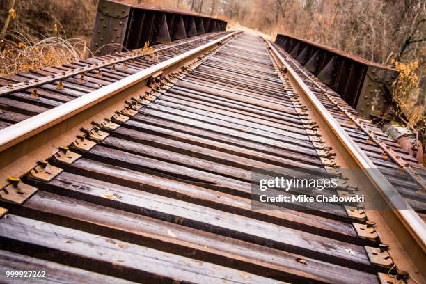 train tracks bridge - eaves stock pictures, royalty-free photos & images