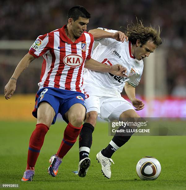 Sevilla's midfielder Diego Capel vies with Atletico Madrid's midfielder Jose Antonio Reyes during the King�s Cup final match Sevilla against Atletico...