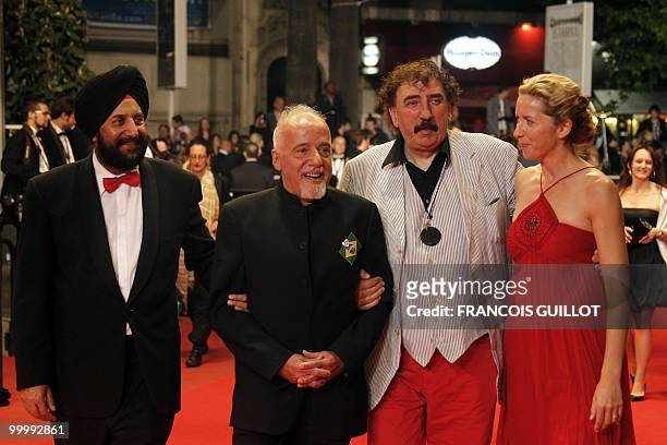 Brazilian writer Paulo Coehlo arrives with guests for the screening of "Schastye Moe" presented in competition at the 63rd Cannes Film Festival on...