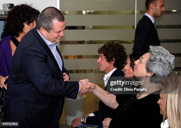 Tommaso Ghirardi president of FC Parma shakes hands with Franca Bertacchini as he arrives at a press conference to announce the renewal of the club's...