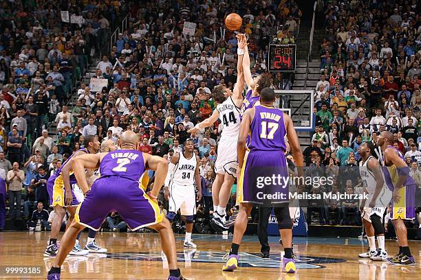 Kyrylo Fesenko of the Utah Jazz and Pau Gasol of the Los Angeles Lakers go after a jump ball in Game Four of the Western Conference Semifinals during...