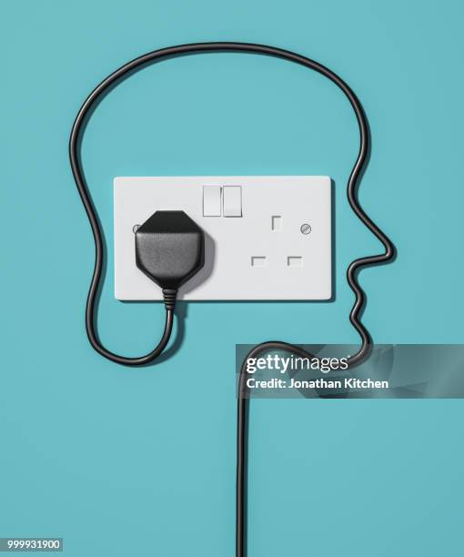 a plug socket with a human face - prise électrique photos et images de collection