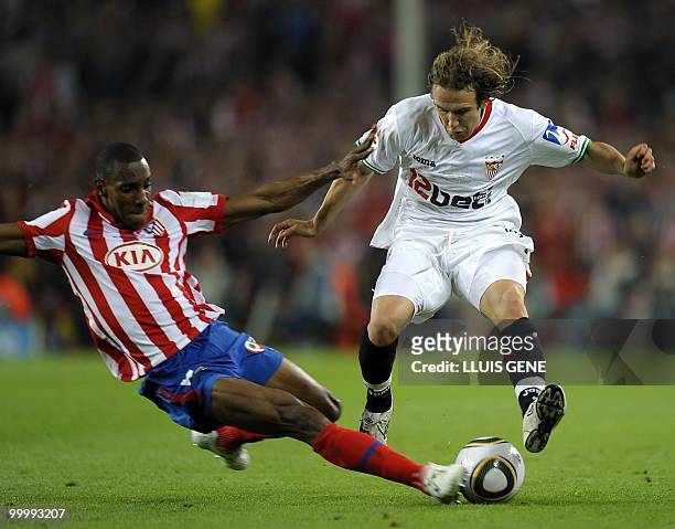 Sevilla's midfielder Diego Capel vies with Atletico Madrid's Colombian defender Luis Perea during the King�s Cup final match Sevilla against Atletico...