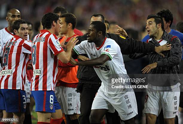 Sevilla's and Atletico Madrid's players argue during the King�s Cup final match Sevilla against Atletico Madrid at the Camp Nou stadium in Barcelona...