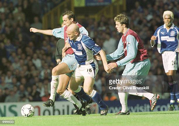 Thomas Gravesen of Everton holds off Don Hutchison of West Ham during the match between Everton and West Ham United in the FA Barclaycard Premiership...