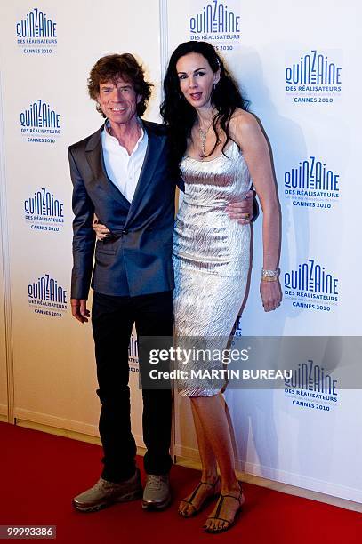 British singer of "The Rolling Stones", Mick Jagger and US stylist L'Wren Scott arrive for the screening of "Stones in Exil" presented as a special...