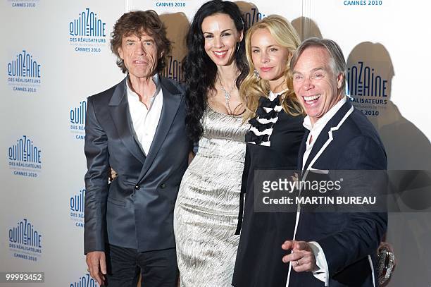 The Rolling Stones British singer Mick Jagger , US stylist L'Wren Scott and US designer Tommy Hilfiger arrive for the screening of "Stones in Exil"...