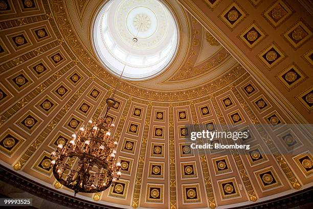 Light fixture hangs in the Capitol building in Washington, D.C., U.S., on Monday, May 17, 2010. The Capitol is the meeting place for the Senate and...