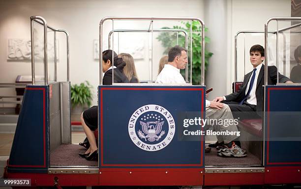 People board a Capitol subway car in the basement of the Capitol building in Washington, D.C., U.S., on Monday, May 17, 2010. The Capitol is the...