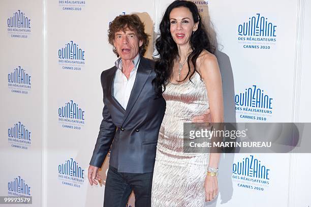 British singer of "The Rolling Stones", Mick Jagger and US stylist L'Wren Scott arrive for the screening of "Stones in Exil" presented as a special...