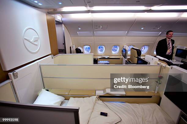 Seat reclined into a bed is photographed in the first class cabin of a Lufthansa Airbus A380 airplane in Frankfurt, Germany, on Wednesday, May 19,...