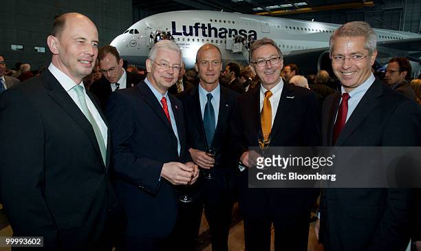 Wolfgang Mayrhuber, chief executive officer of Lufthansa AG, second from right, stands with, from left, Wolfgang Tiefensee, Germany's minister of...