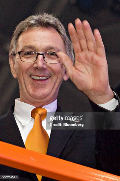 Wolfgang Mayrhuber, chief executive officer of Lufthansa AG, waves during a ceremony following the arrival of the airlines first Airbus A380...