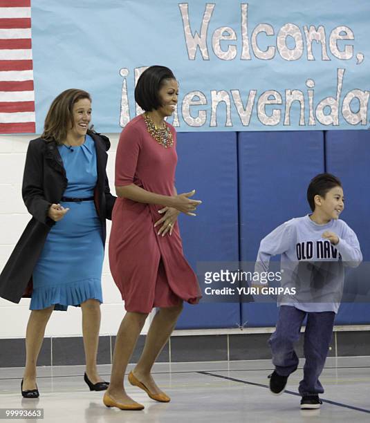 First Lady Michelle Obama and Mexican First Lady Margarita Zavala take part in gym class activities as they visit New Hampshire Elementary School in...