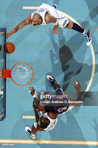 Carlos Boozer of the Utah Jazz shoots a layup against Ron Artest of the Los Angeles Lakers in Game Three of the Western Conference Semifinals during...