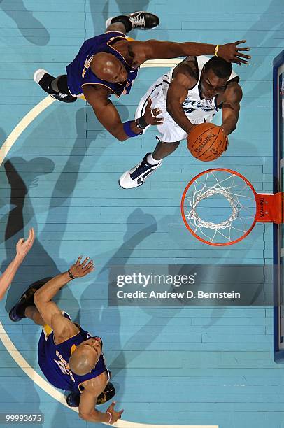 Paul Millsap of the Utah Jazz takes the ball to the basket against Lamar Odom of the Los Angeles Lakers in Game Three of the Western Conference...