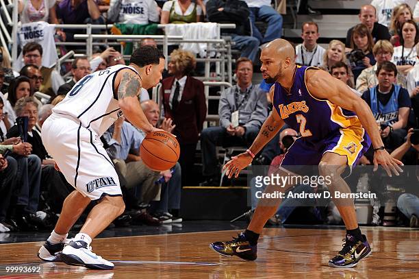 Derek Fisher of the Los Angeles Lakers defends against Deron Williams of the Utah Jazz in Game Three of the Western Conference Semifinals during the...