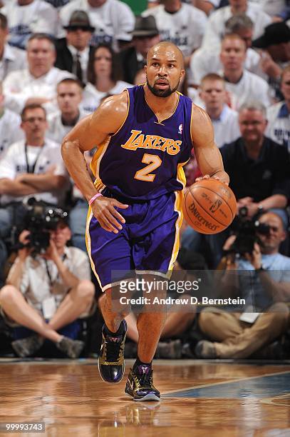 Derek Fisher of the Los Angeles Lakers moves the ball up court in Game Three of the Western Conference Semifinals against the Utah Jazz during the...