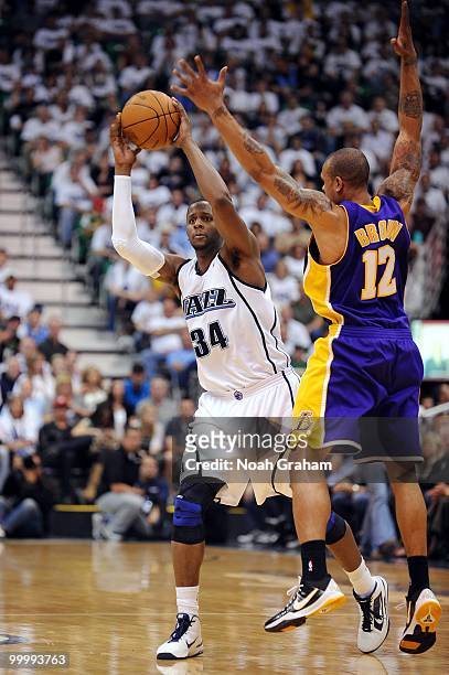 Miles of the Utah Jazz passes against Shannon Brown of the Los Angeles Lakers in Game Three of the Western Conference Semifinals during the 2010 NBA...