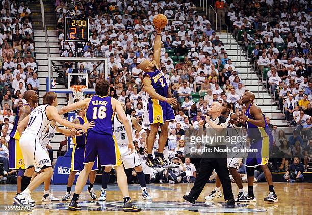 Derek Fisher of the Los Angeles Lakers goes up for a jump ball against Wesley Matthews of the Utah Jazz in Game Three of the Western Conference...