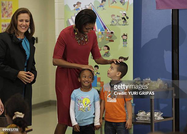 First Lady Michelle Obama and Mexican first lady Margarita Zavala greet children during a lunch as they visit New Hampshire Elementary School in...