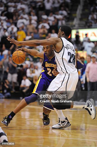 Kobe Bryant of the Los Angeles Lakers drives the ball against Wesley Matthews of the Utah Jazz in Game Three of the Western Conference Semifinals...