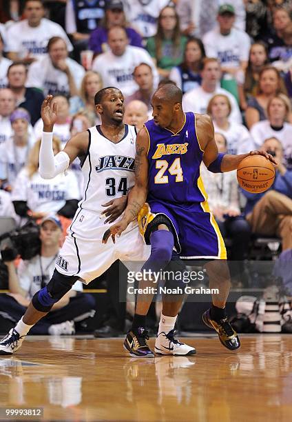 Kobe Bryant of the Los Angeles Lakers posts up against C.J. Miles of the Utah Jazz in Game Three of the Western Conference Semifinals during the 2010...