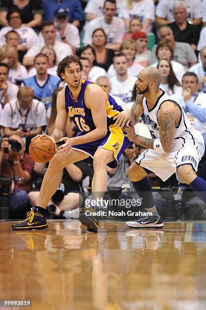 Pau Gasol of the Los Angeles Lakers posts up against Carlos Boozer of the Utah Jazz in Game Three of the Western Conference Semifinals during the...