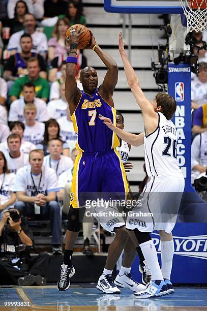 Lamar Odom of the Los Angeles Lakers looks to pass against Kyle Korver of the Utah Jazz in Game Three of the Western Conference Semifinals during the...