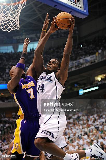 Paul Millsap of the Utah Jazz takes the ball to the basket against Lamar Odom of the Los Angeles Lakers in Game Three of the Western Conference...
