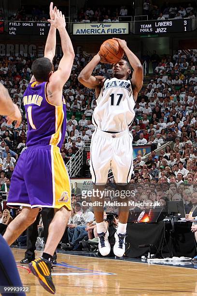 Ronnie Price of the Utah Jazz shoots a jump shot against Jordan Farmar of the Los Angeles Lakers in Game Three of the Western Conference Semifinals...