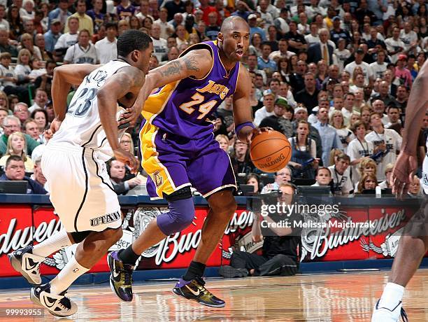 Kobe Bryant of the Los Angeles Lakers moves the ball against Wesley Matthews of the Utah Jazz in Game Three of the Western Conference Semifinals...