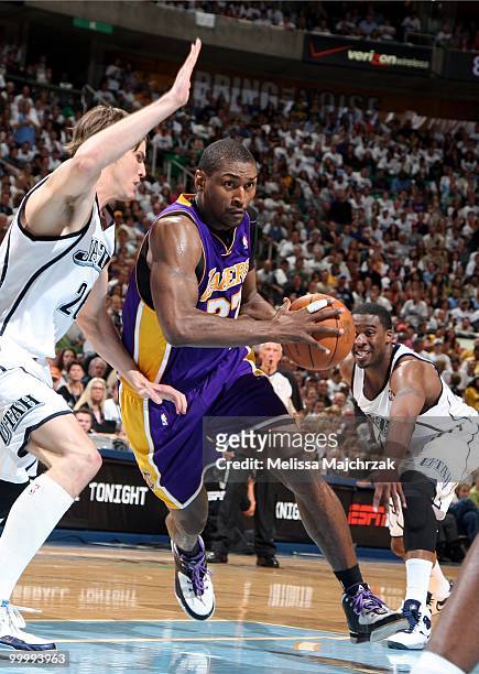 Ron Artest of the Los Angeles Lakers drives to the basket against Kyle Korver and Wesley Matthews of the Utah Jazz in Game Three of the Western...