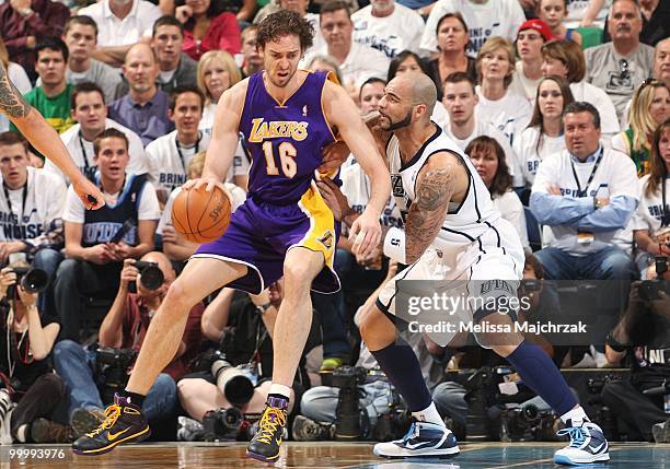 Pau Gasol of the Los Angeles Lakers posts up against Carlos Boozer of the Utah Jazz in Game Three of the Western Conference Semifinals during the...