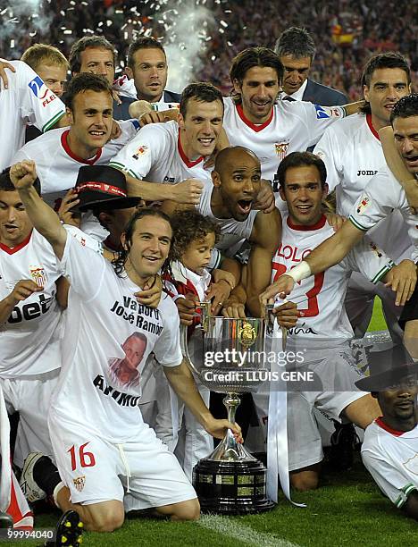 Sevilla's players celebrate after winning the King�s Cup final match against Atletico Madrid at the Camp Nou stadium in Barcelona on May 19, 2010....