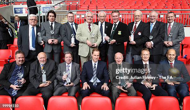 Prince William poses for a photo with the Respect and Fair Play Award winners at Wembley Stadium on May 15, 2010 in London, England.