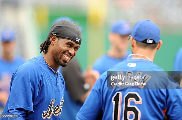 Jose Reyes of the New York Mets talks with Angel Pagan before the game against the Washington Nationals at Nationals Park on May 19, 2010 in...