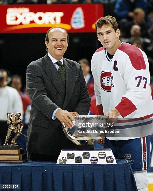 Pierre Turgeon of the Montreal Canadiens receives an award during the mid-1990's at the Montreal Forum in Montreal, Quebec, Canada. Turgeon played...