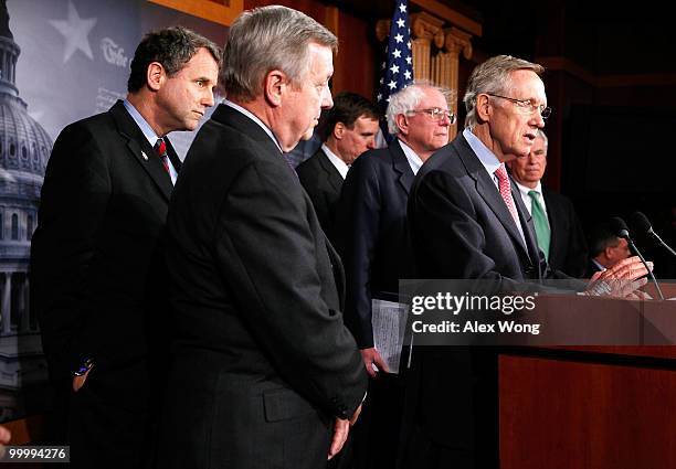 Senate Majority Leader Sen. Harry Reid speaks as Senate Majority Whip Richard Durbin Sen. Sherrod Brown , Sen. Mark Warner , Sen. Bernard Sanders and...