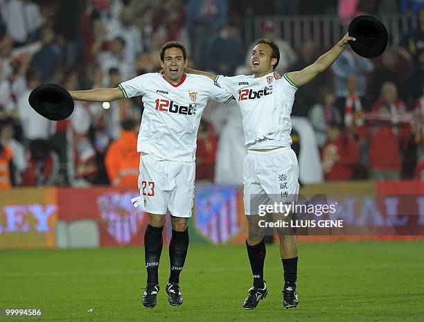 Sevilla's defender Lolo and Sevilla's French defender Sebastien Squillaci celebrate after winning the King's Cup final match against Atletico Madrid...