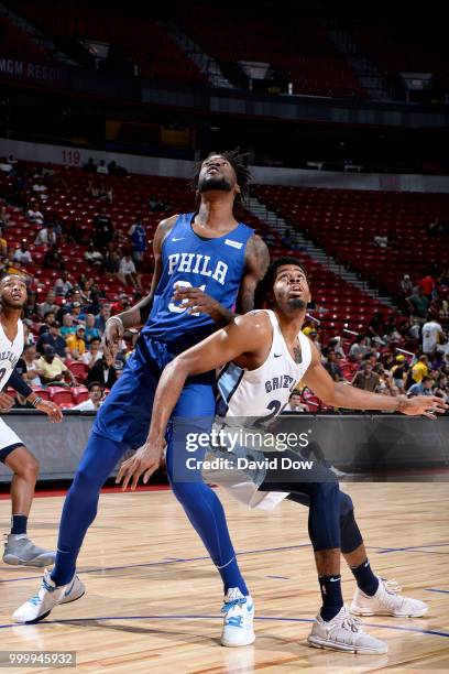 Norvel Pelle of the Philadelphia 76ers and DJ Stephens of the Memphis Grizzlies battle for position during the 2018 Las Vegas Summer League on July...