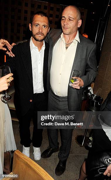 Dan MacMillan and Dinos Chapman attend the launch party for the opening of TopShop's Knightsbridge store on May 19, 2010 in London, England.