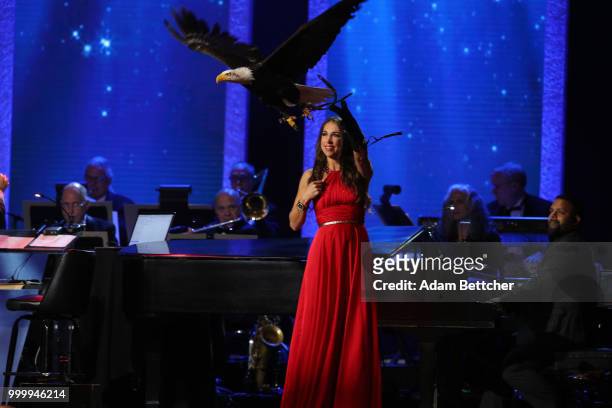 Laura Sterbens releases an eagle at the 2018 So the World May Hear Awards Gala benefitting Starkey Hearing Foundation at the Saint Paul RiverCentre...