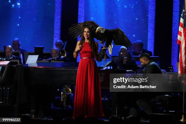 Laura Sterbens releases an eagle at the 2018 So the World May Hear Awards Gala benefitting Starkey Hearing Foundation at the Saint Paul RiverCentre...