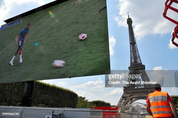 Security is taightened as French football fans gather in the Champs-de-Mars fan zone, in front of the Eiffel Tower, to watch the FIFA 2018 World Cup...